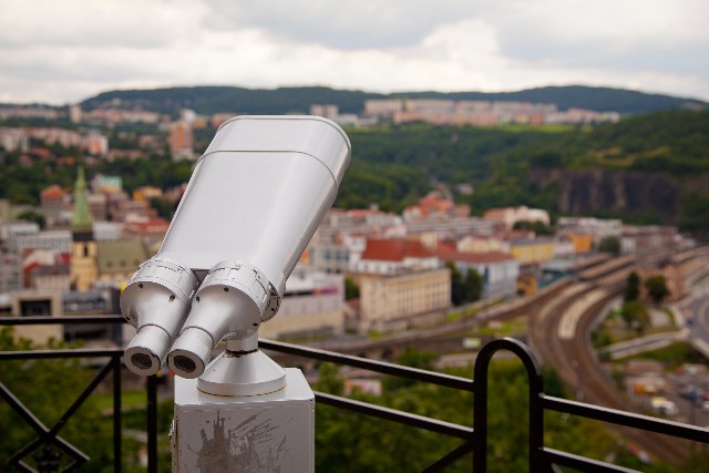 A telescope looking out onto a city.